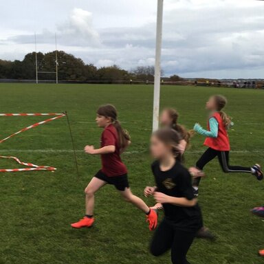Girls running in the cross country event