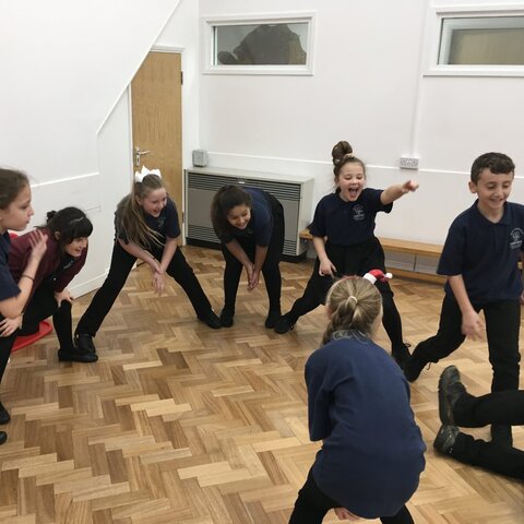 Sports leaders in a circle practising