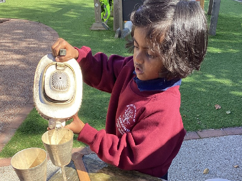 Child playing with water.